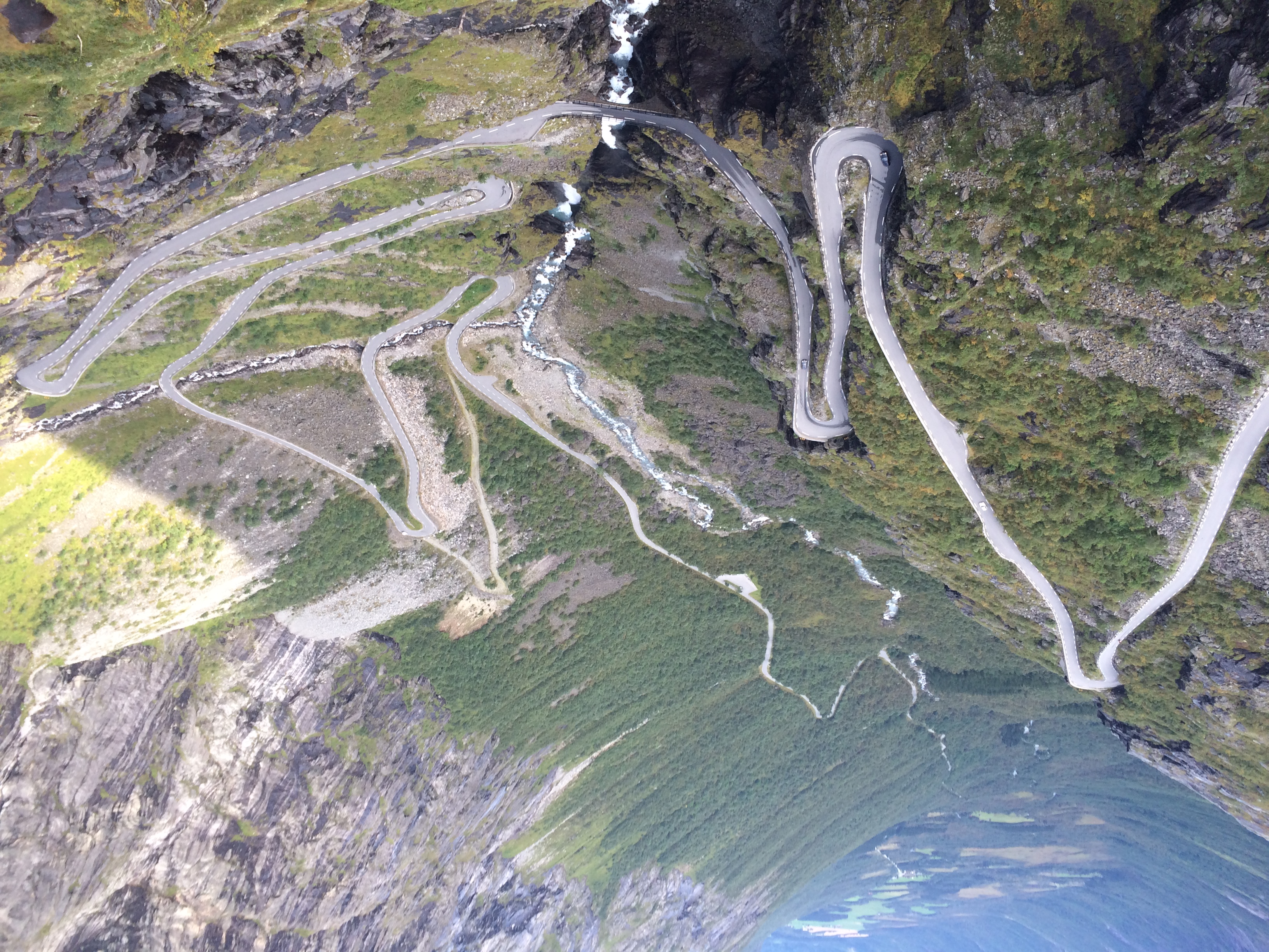 A peaceful road winding through the Norwegian countryside